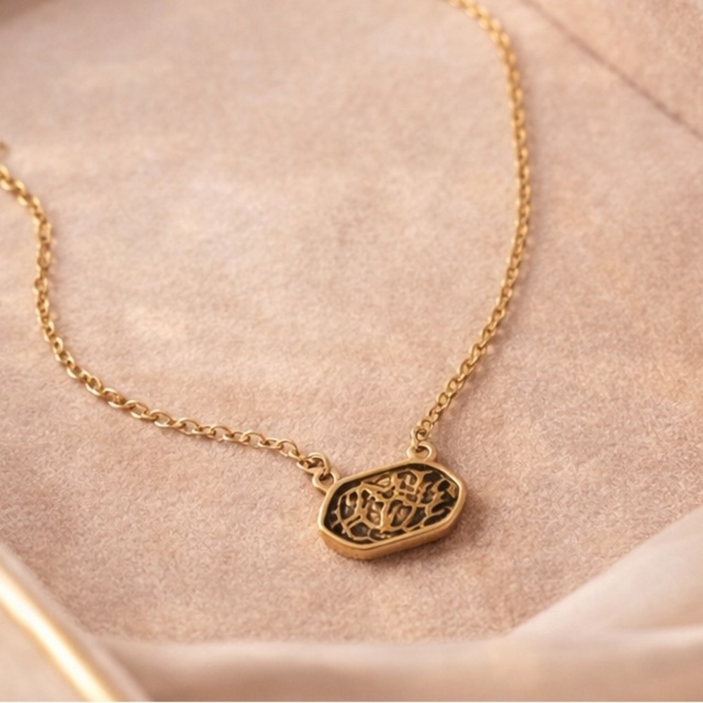 Gold Necklace with Intricate Pendant Design